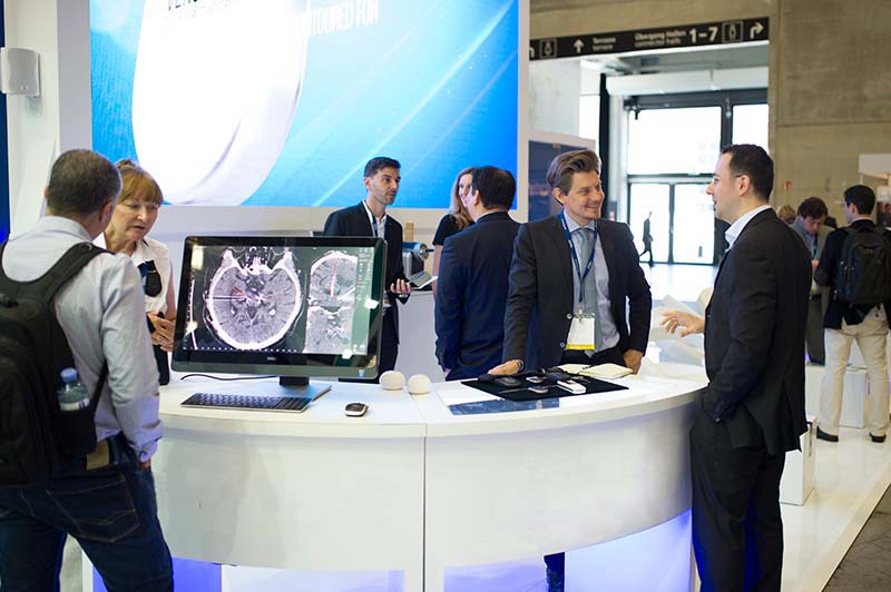 Delegates engage at an interactive sponsor booth at the International Congress.