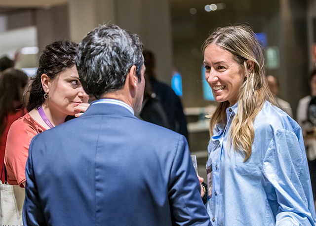 A crowd of delegates from around the globe clap at the International Congress.